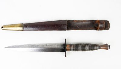 two knives are shown side by side on a white surface