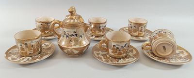a group of cups and saucers sitting on a table