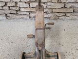 a small wooden scooter sitting on the concrete floor