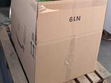 a cardboard box sitting on a pallet in a warehouse