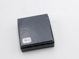 a small black box with a white sticker on it