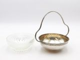 silver plated bowl and glass bowl with handle on a white background