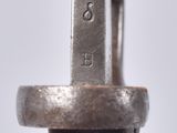 a close up of a metal object with a ring on it