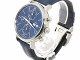 a watch with a blue dial on a blue leather strap