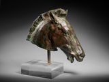 an image of a bronze head of a horse on a marble base