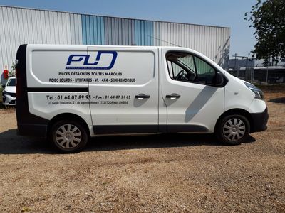 a white van that is parked in front of a building