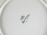 a white plate with black writing on it on a table