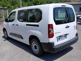 a white van that is parked in a parking lot