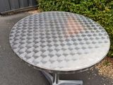 an image of a metal table with a checkered pattern on it