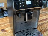 an image of a coffee machine on a wooden table