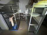 an image of a commercial kitchen with stainless steel racks