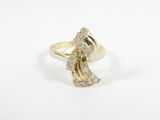 a gold and diamond ring with a wave design