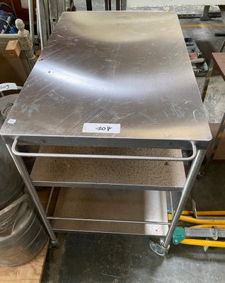 a metal table that is sitting in the middle of a room