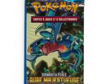 a close up of a blue card case with a dragon on it