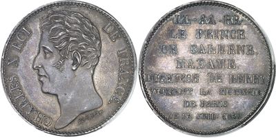 a close up of a coin with a woman ' s face on it