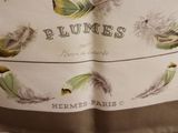 a picture of a close up of a pillow with feathers on it