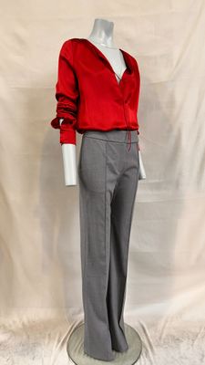 an image of a mannequin wearing a red shirt and grey pants