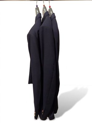 two umbrellas that are hanging on a clothes rack