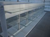 a glass display case in the middle of a store