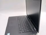 a laptop computer sitting on a table with a white background