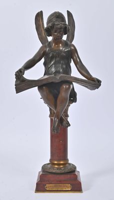 an image of a bronze statue of a woman sitting on top of a table