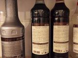 several bottles of alcohol are lined up on a counter top