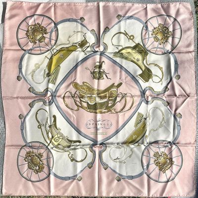 a pink scarf with a picture of a horse and carriage on it