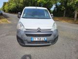 a small white van parked on the side of the road