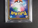 a close up of a pokemon card in a clear plastic case
