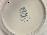a white plate with a picture of a man on it