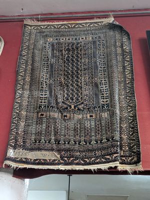 a rug on display on a red table