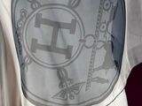 a white t - shirt with a design on it on a mannequin