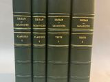 a set of five green books sitting on top of each other
