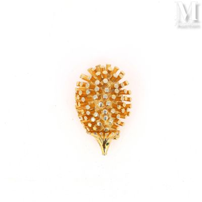 an image of a gold brooch with diamonds on a white background