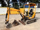 a small excavator that is sitting in the dirt
