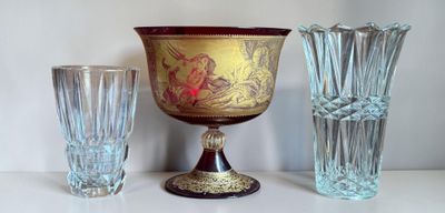 three glass vases and a vase on a table