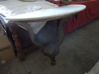 a table with a surfboard on it in a room