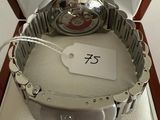 a watch in a box with a price tag on it