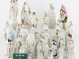 a lot of figurines that are sitting on a table