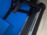 a picture of a treadie machine in a blue room