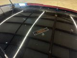 a close up of a car roof with a sticker on it