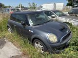a small car that is parked in the grass