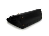 the black leather clutch bag is open and ready to be used