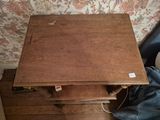 a small wooden table with a drawer underneath it