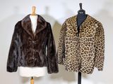 pair of leopard fur coats on mannequins on display