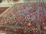 a large oriental rug on the floor in a store
