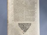 an old book with a black and white drawing on it