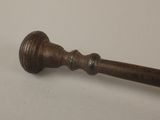 a wooden handle that is on a white table