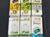 six pairs of foot feet in different sizes and colors