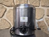 a stainless steel blender sitting on top of a table